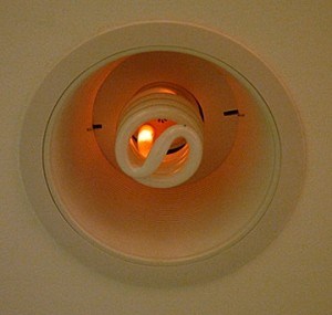 A CFL in recessed can starting to burn
